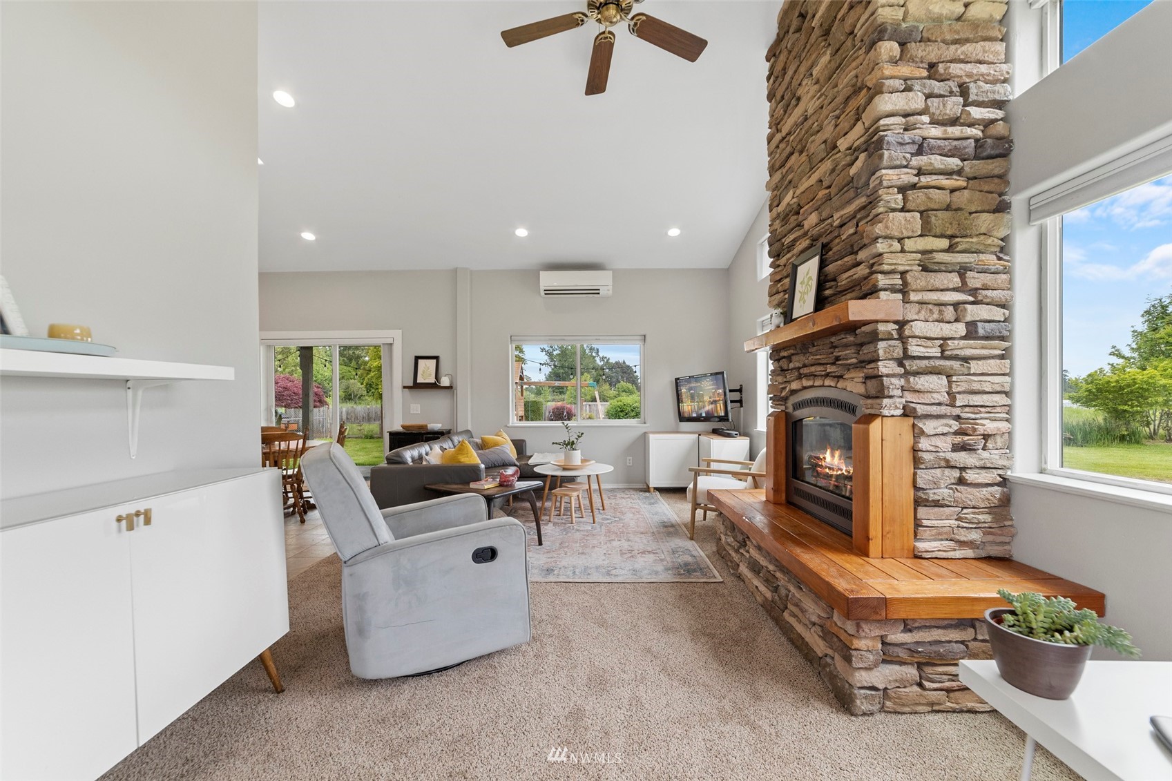 3166 Douglas Road Ferndale, WA 98248 - Photo 16 of 38 a living room with furniture and a fireplace