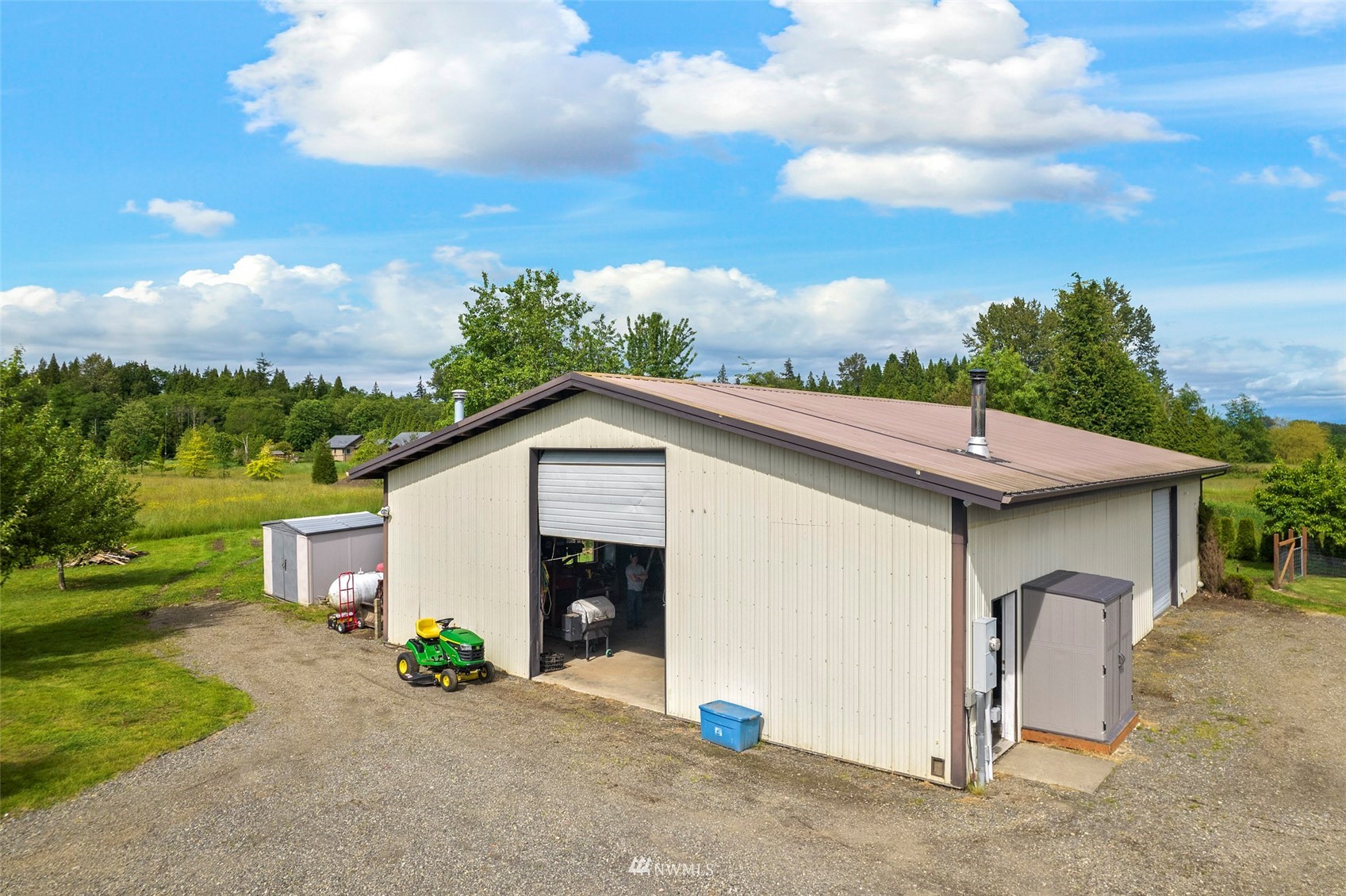3166 Douglas Road Ferndale, WA 98248 - Photo 26 of 38 a view of a house with a yard plants and a garage