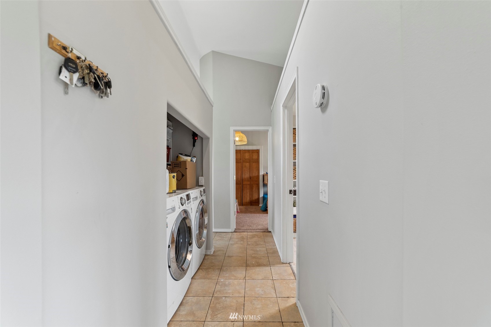 3166 Douglas Road Ferndale, WA 98248 - Photo 8 of 38 a view of a hallway with washer and dryer