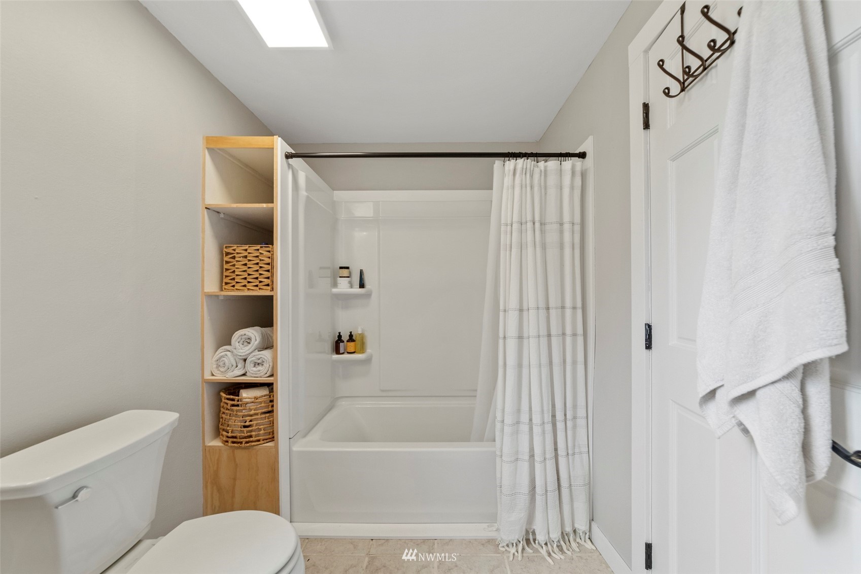 3166 Douglas Road Ferndale, WA 98248 - Photo 10 of 38 a bathroom with a toilet and a bathtub