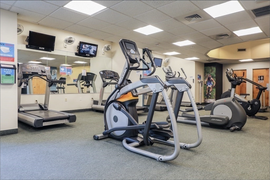 99 Pond Avenue, Unit 409 Brookline, MA 02445 - Photo 21 of 28 a view of a room with gym equipment