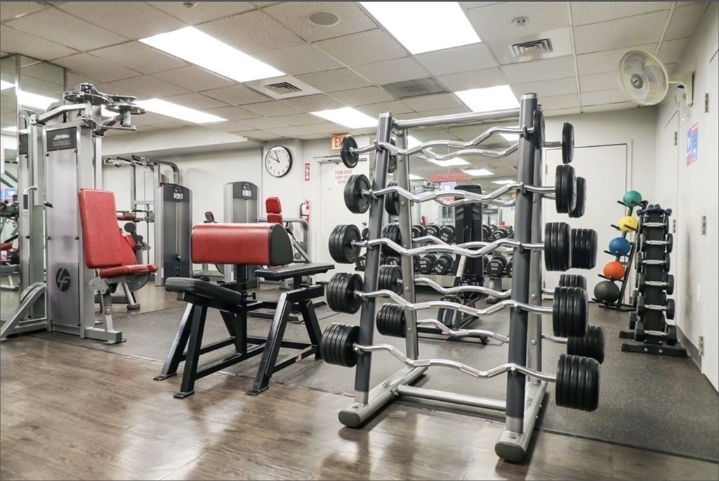 99 Pond Avenue, Unit 409 Brookline, MA 02445 - Photo 22 of 28 a view of a room with gym equipment