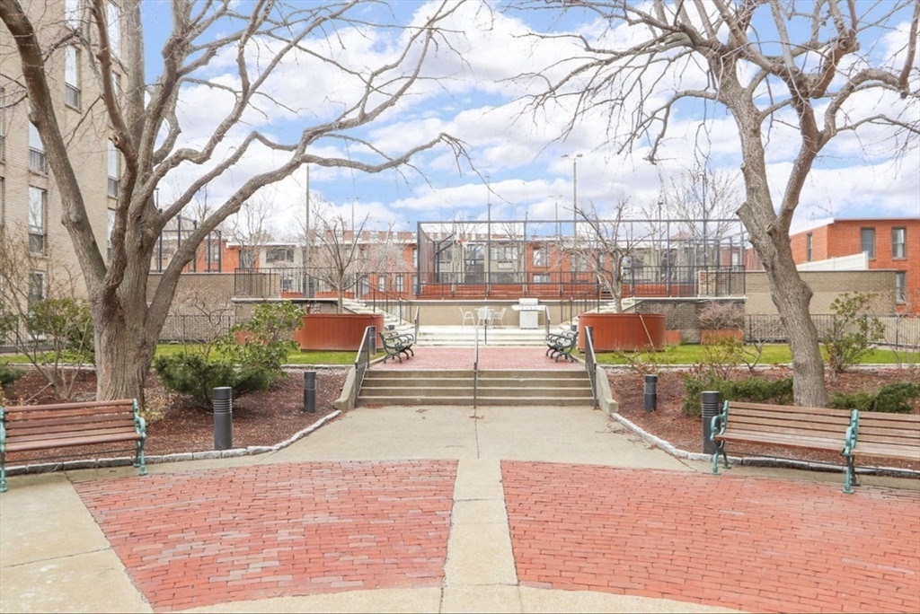 99 Pond Avenue, Unit 409 Brookline, MA 02445 - Photo 27 of 28 a building outdoor space with patio furniture