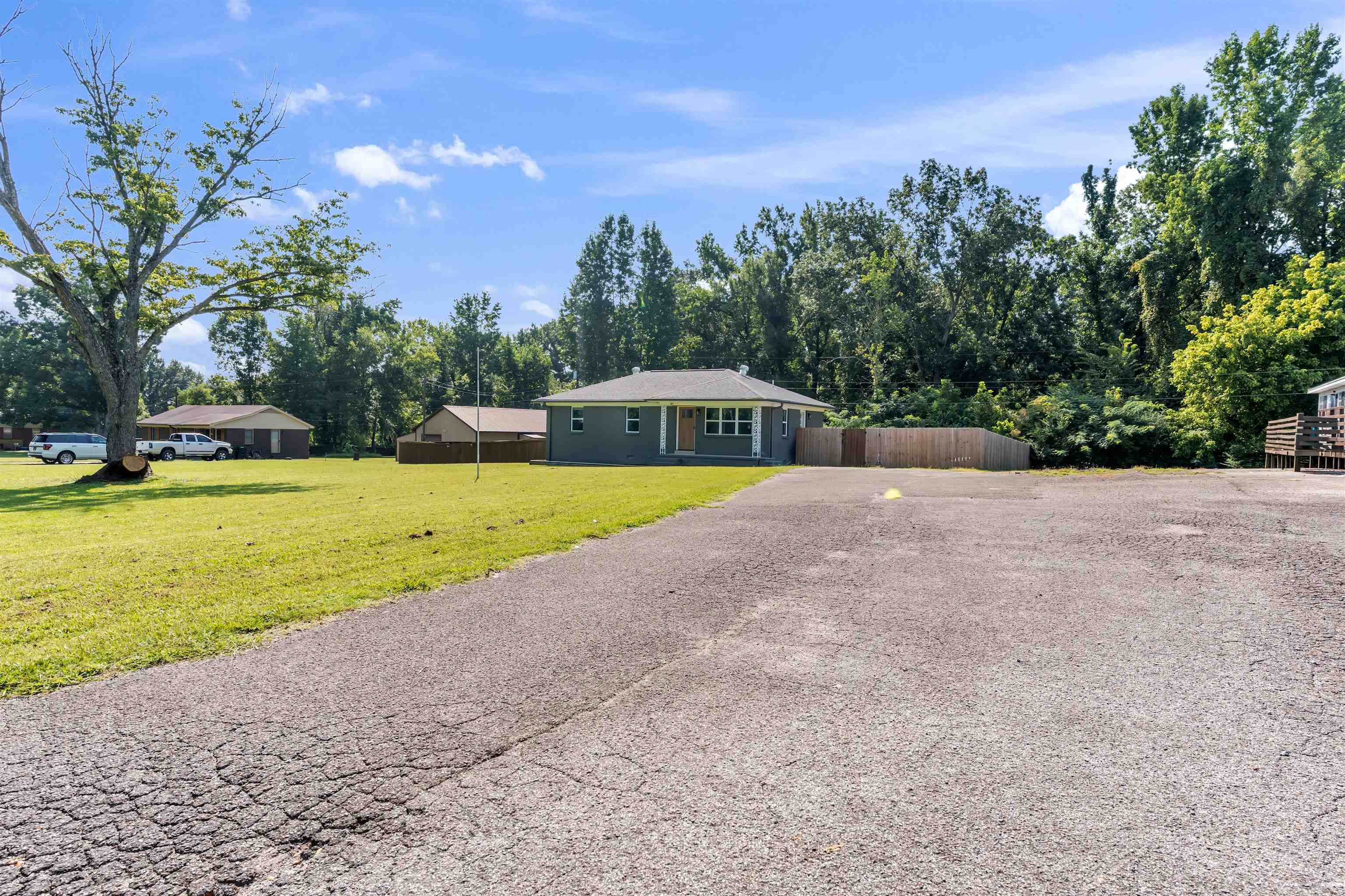 185 Henry Road Somerville, TN 38068 - Photo 2 of 21 Single-story residence with a gray exterior, white trim, and a covered front entry