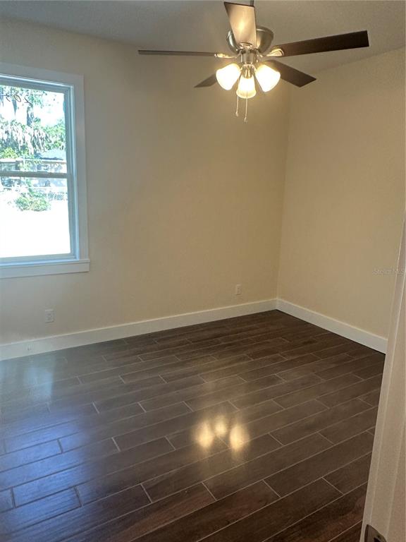4011 Amber Road Valrico, FL 33594 - Photo 20 of 32 a view of a room with wooden floor and a window