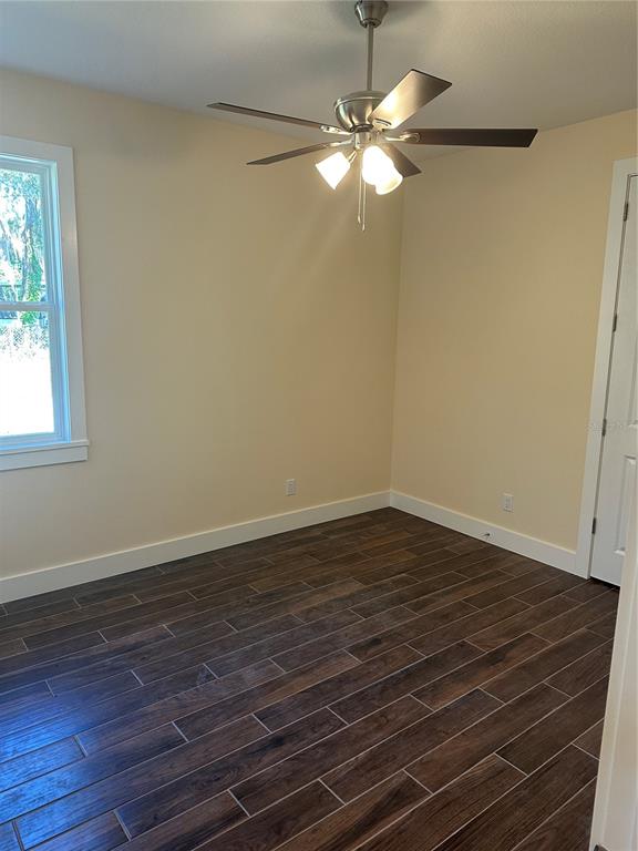 4011 Amber Road Valrico, FL 33594 - Photo 23 of 32 a view of a room with wooden floor and fan