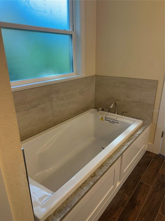 4011 Amber Road Valrico, FL 33594 - Photo 9 of 32 a view of a bath tub sitting in a bathroom