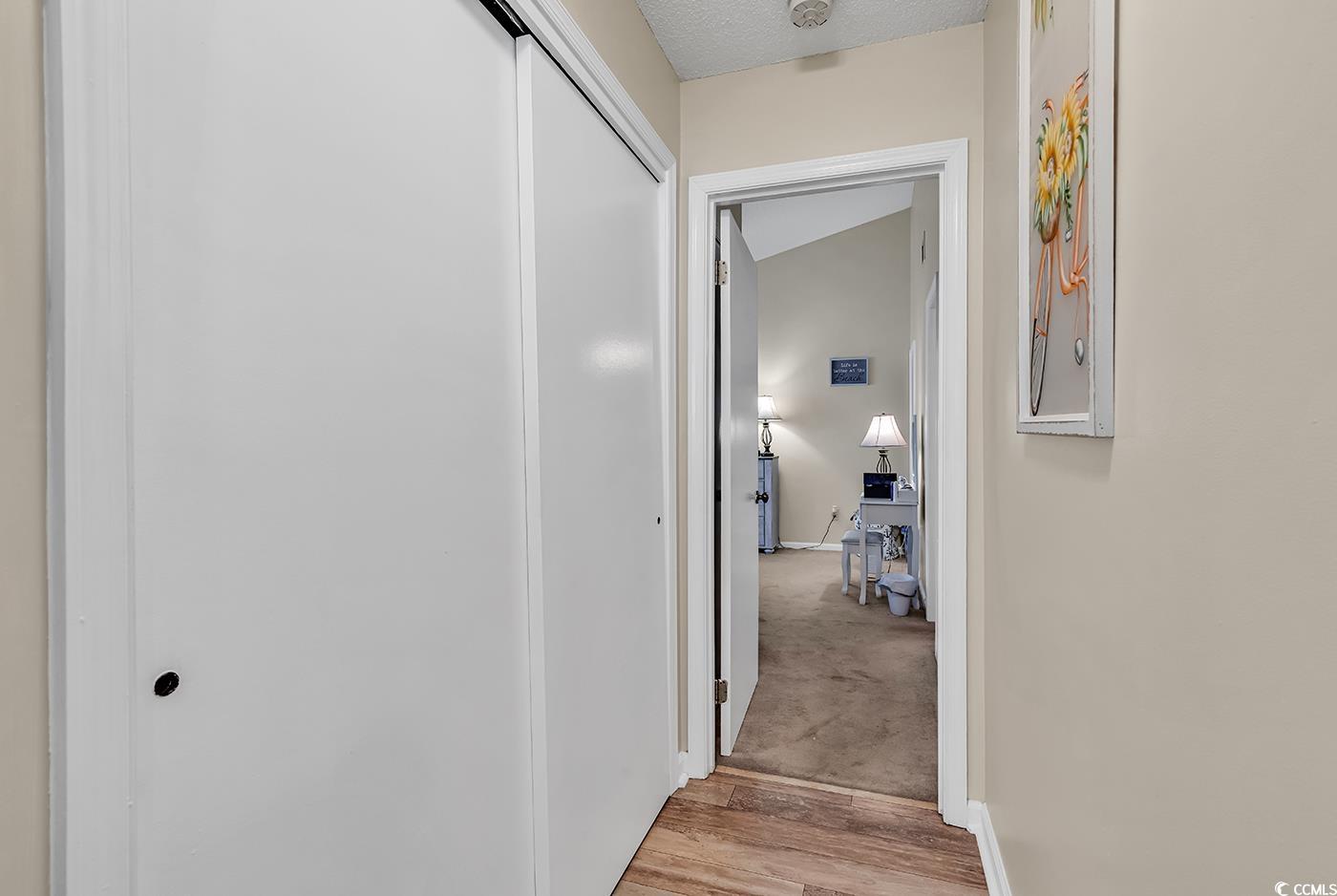 6628 Mallard View Point Myrtle Beach, SC 29588 - Photo 12 of 34 Corridor with baseboards and light wood finished floors