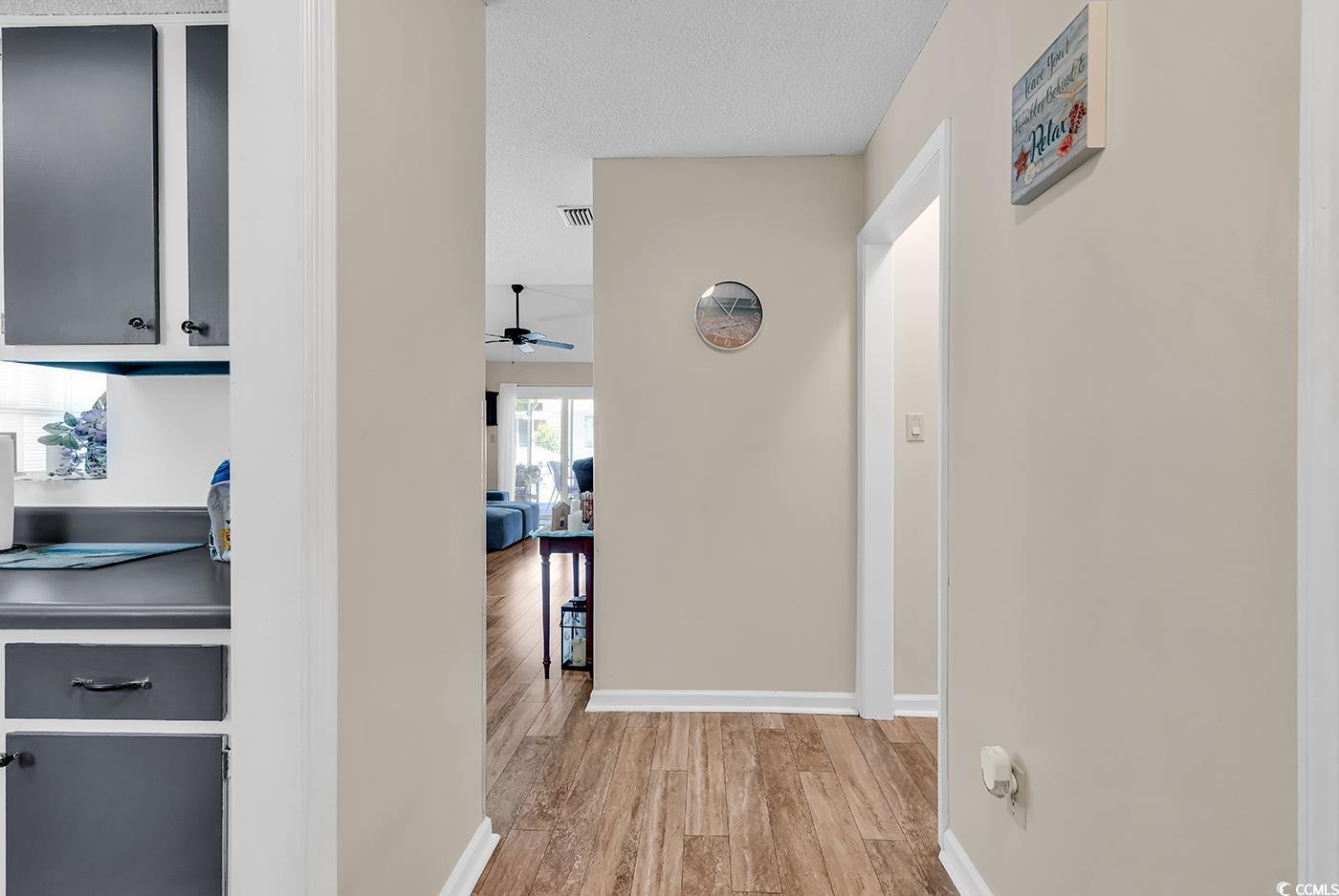 6628 Mallard View Point Myrtle Beach, SC 29588 - Photo 14 of 34 Hallway with light wood-style floors, baseboards, and visible vents