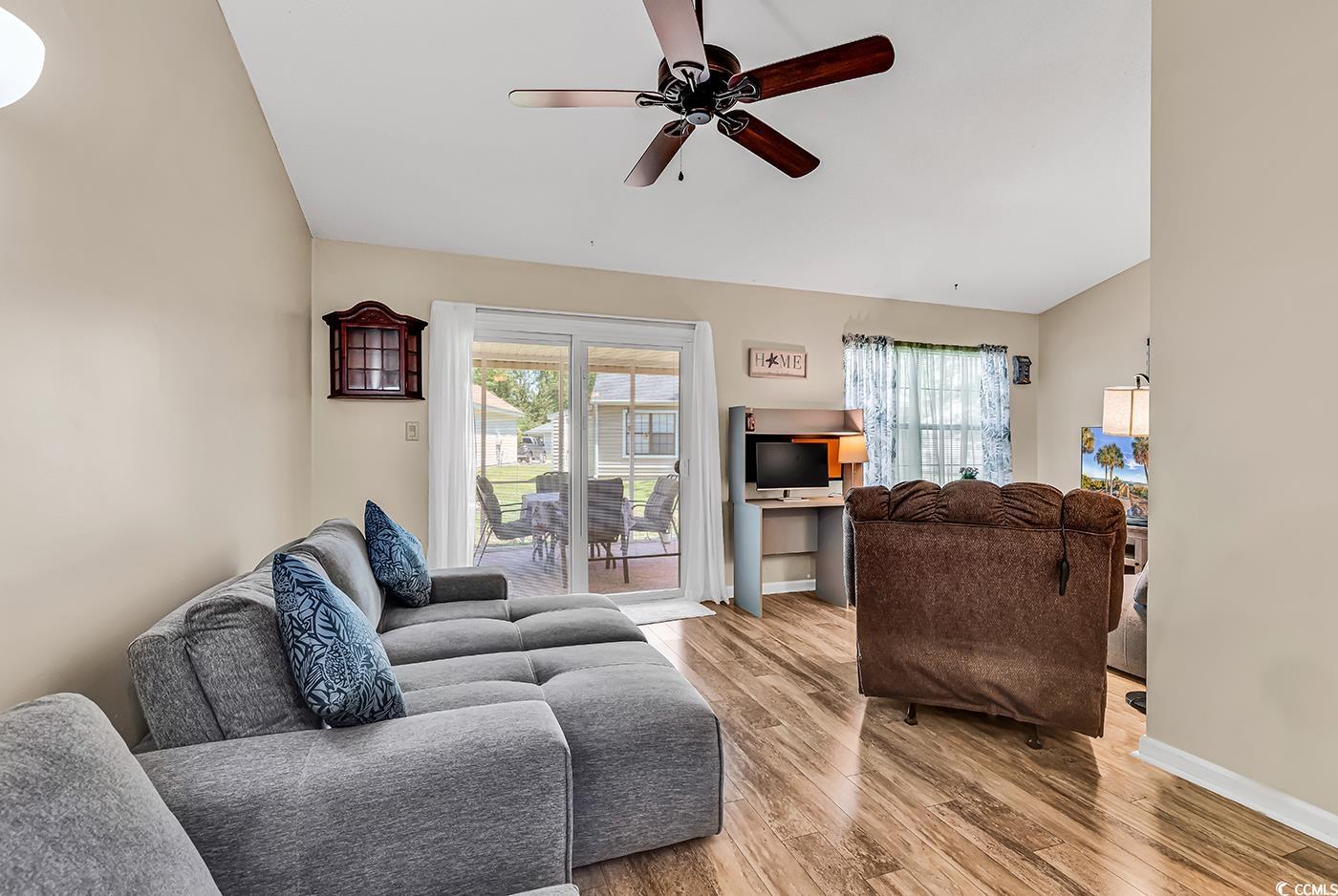 6628 Mallard View Point Myrtle Beach, SC 29588 - Photo 18 of 34 Living area with plenty of natural light, light wood finished floors, ceiling fan, and vaulted ceiling