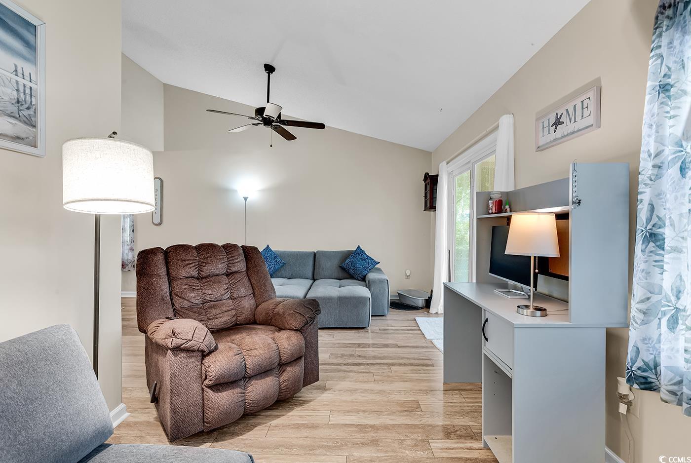 6628 Mallard View Point Myrtle Beach, SC 29588 - Photo 21 of 34 Living room featuring ceiling fan, light wood-style flooring, and lofted ceiling