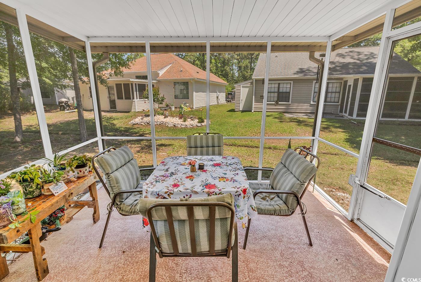 6628 Mallard View Point Myrtle Beach, SC 29588 - Photo 22 of 34 Sunroom / solarium with plenty of natural light and outdoor dining space