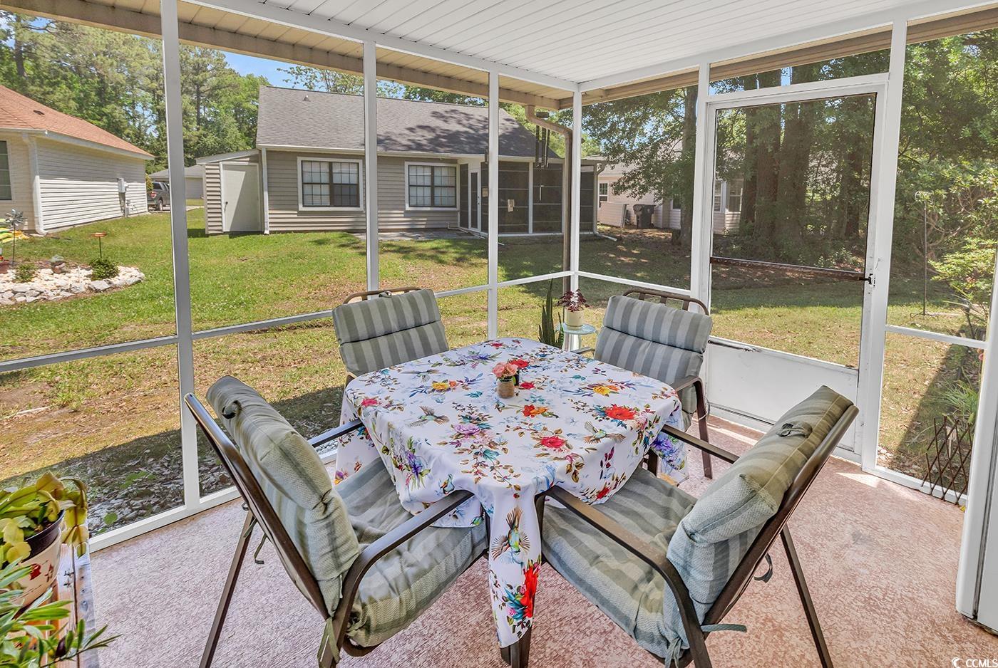 6628 Mallard View Point Myrtle Beach, SC 29588 - Photo 23 of 34 Sunroom featuring outdoor dining space