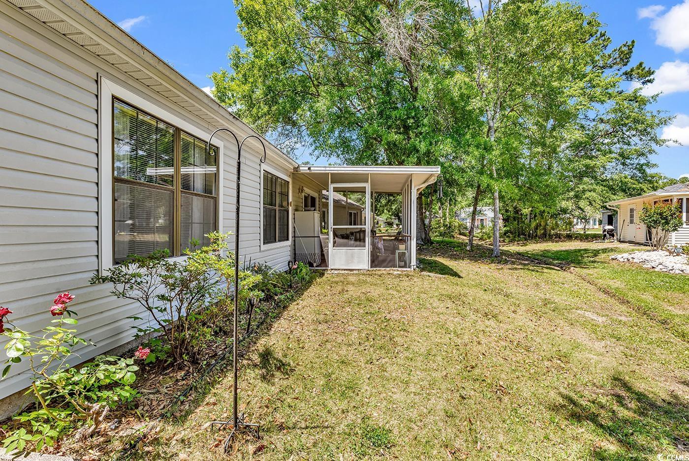 6628 Mallard View Point Myrtle Beach, SC 29588 - Photo 24 of 34 View of yard with a sunroom