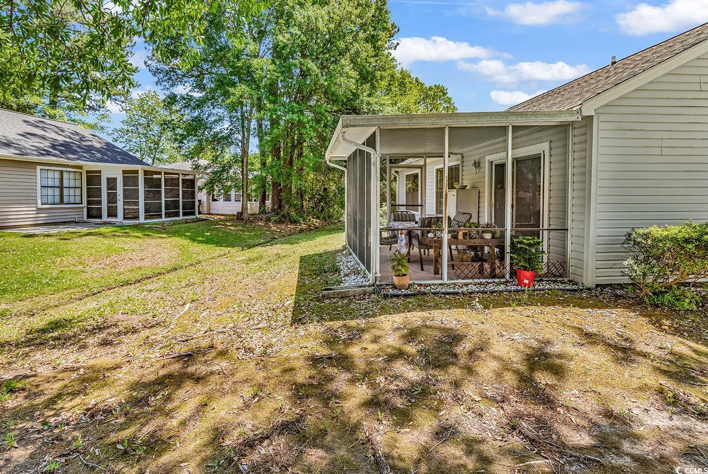 6628 Mallard View Point Myrtle Beach, SC 29588 - Photo 26 of 34 View of yard with a sunroom