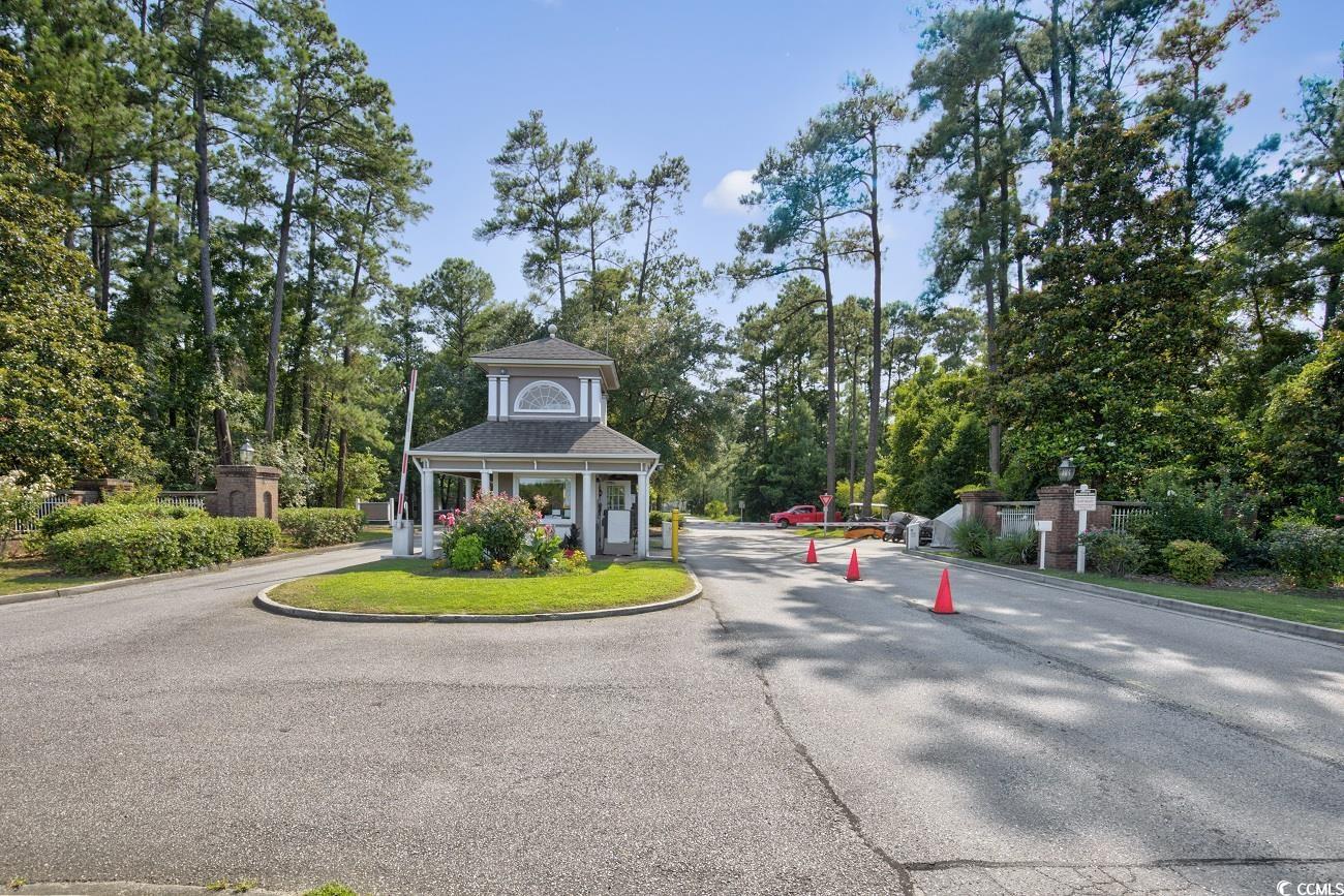 6628 Mallard View Point Myrtle Beach, SC 29588 - Photo 30 of 34 View of street with curbs and a gated entry