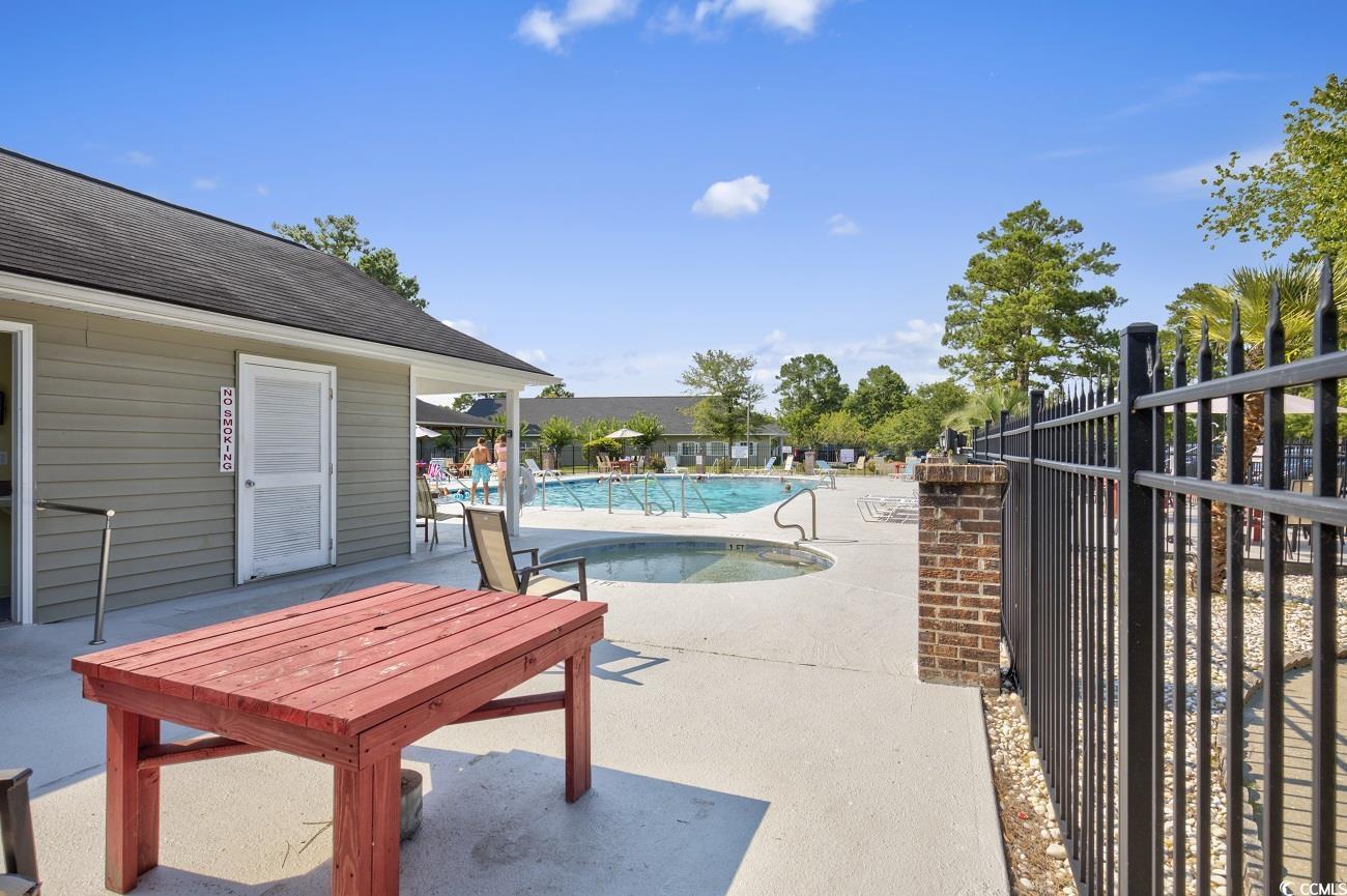 6628 Mallard View Point Myrtle Beach, SC 29588 - Photo 31 of 34 Pool featuring fence and a patio area