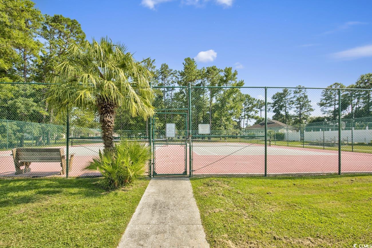 6628 Mallard View Point Myrtle Beach, SC 29588 - Photo 32 of 34 View of sport court with fence, a gate, and a yard