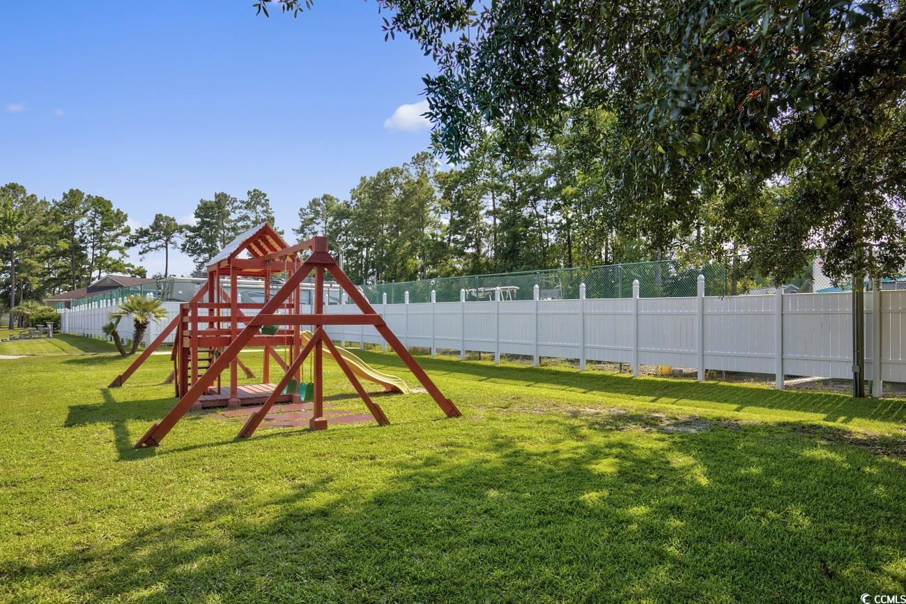 6628 Mallard View Point Myrtle Beach, SC 29588 - Photo 33 of 34 View of play area featuring fence and a yard