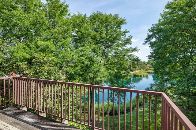 a balcony with trees in front of it