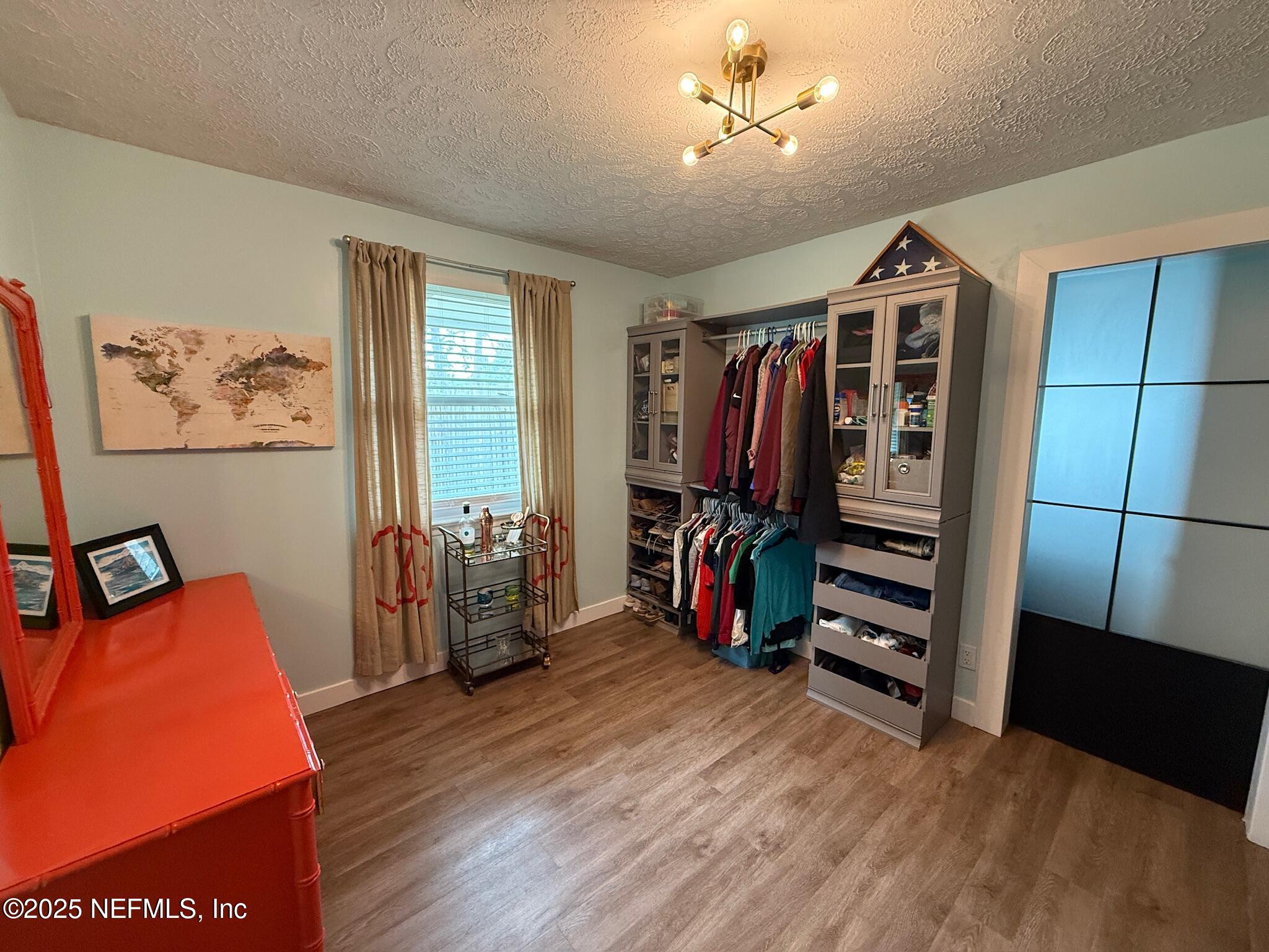 716 Oak Street Neptune Beach, FL 32266 - Photo 11 of 23 a view of walk in closet with clothes and shoes