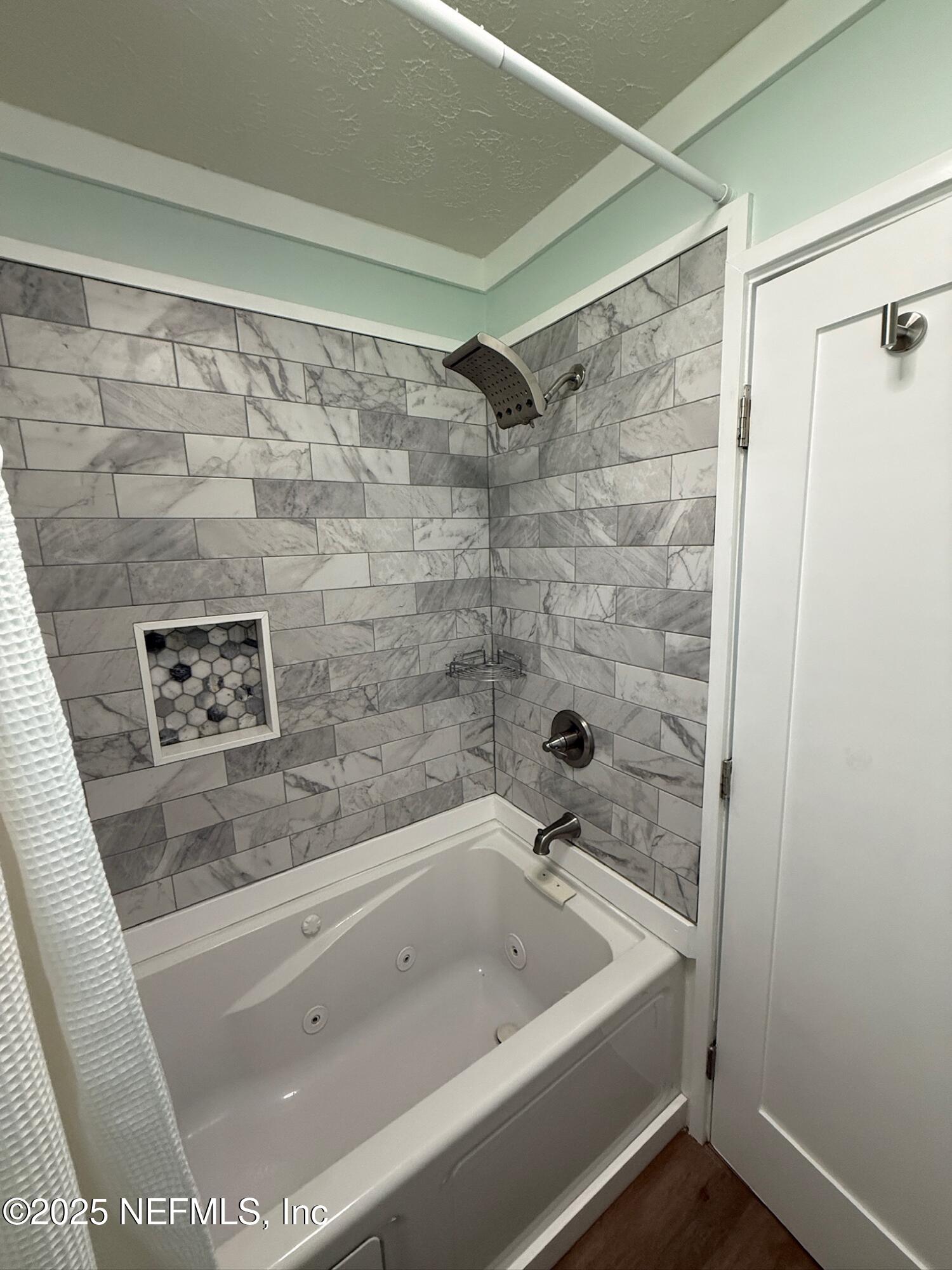716 Oak Street Neptune Beach, FL 32266 - Photo 12 of 23 a bath tub sitting next to a shower