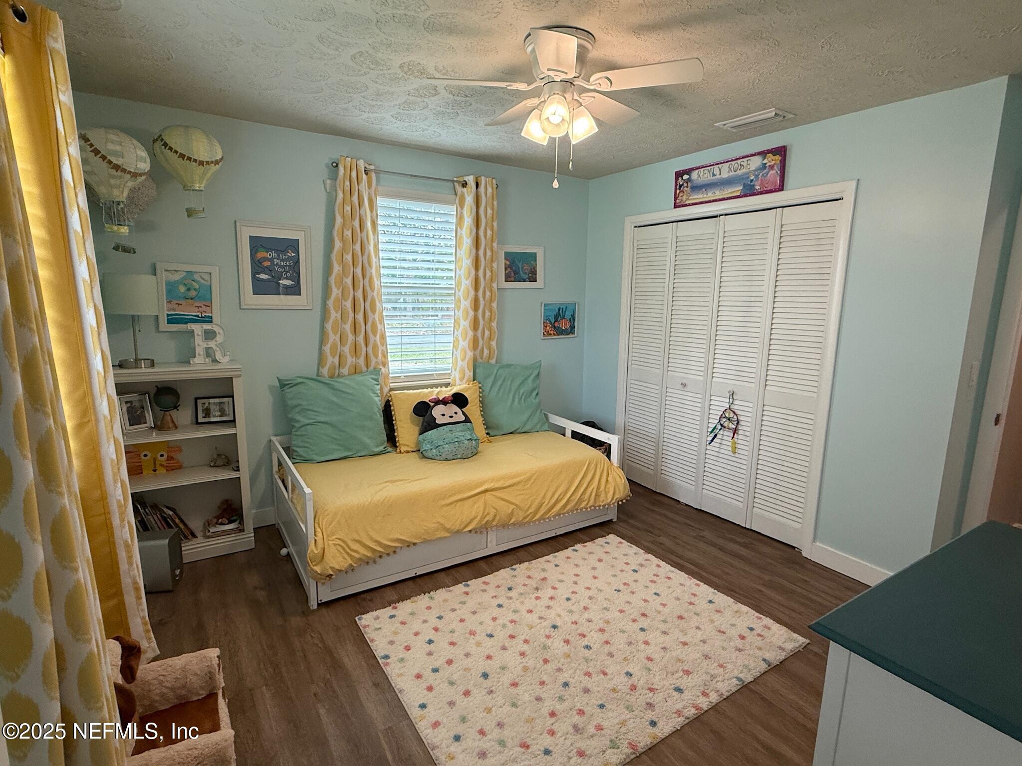 716 Oak Street Neptune Beach, FL 32266 - Photo 16 of 23 a bedroom with a bed and a dresser in it