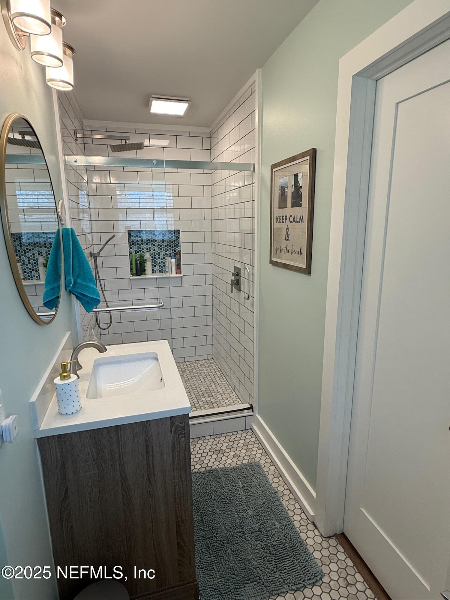 716 Oak Street Neptune Beach, FL 32266 - Photo 18 of 23 a bathroom with a sink a toilet and shower