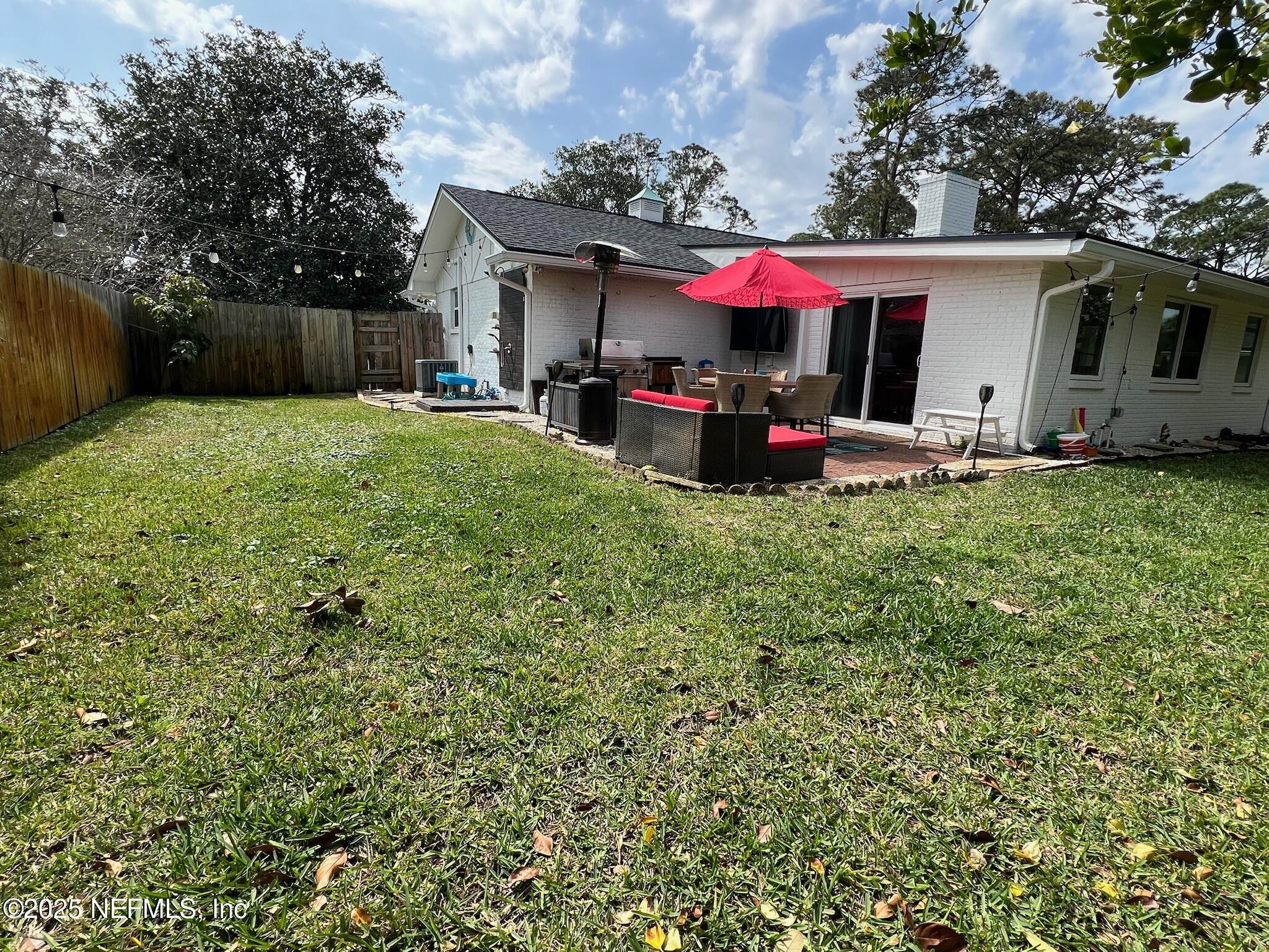 716 Oak Street Neptune Beach, FL 32266 - Photo 22 of 23 a view of a house with a yard and sitting area