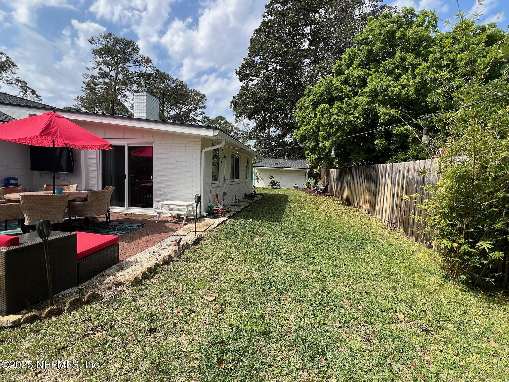 716 Oak Street Neptune Beach, FL 32266 - Photo 23 of 23 a view of a house with backyard and sitting area