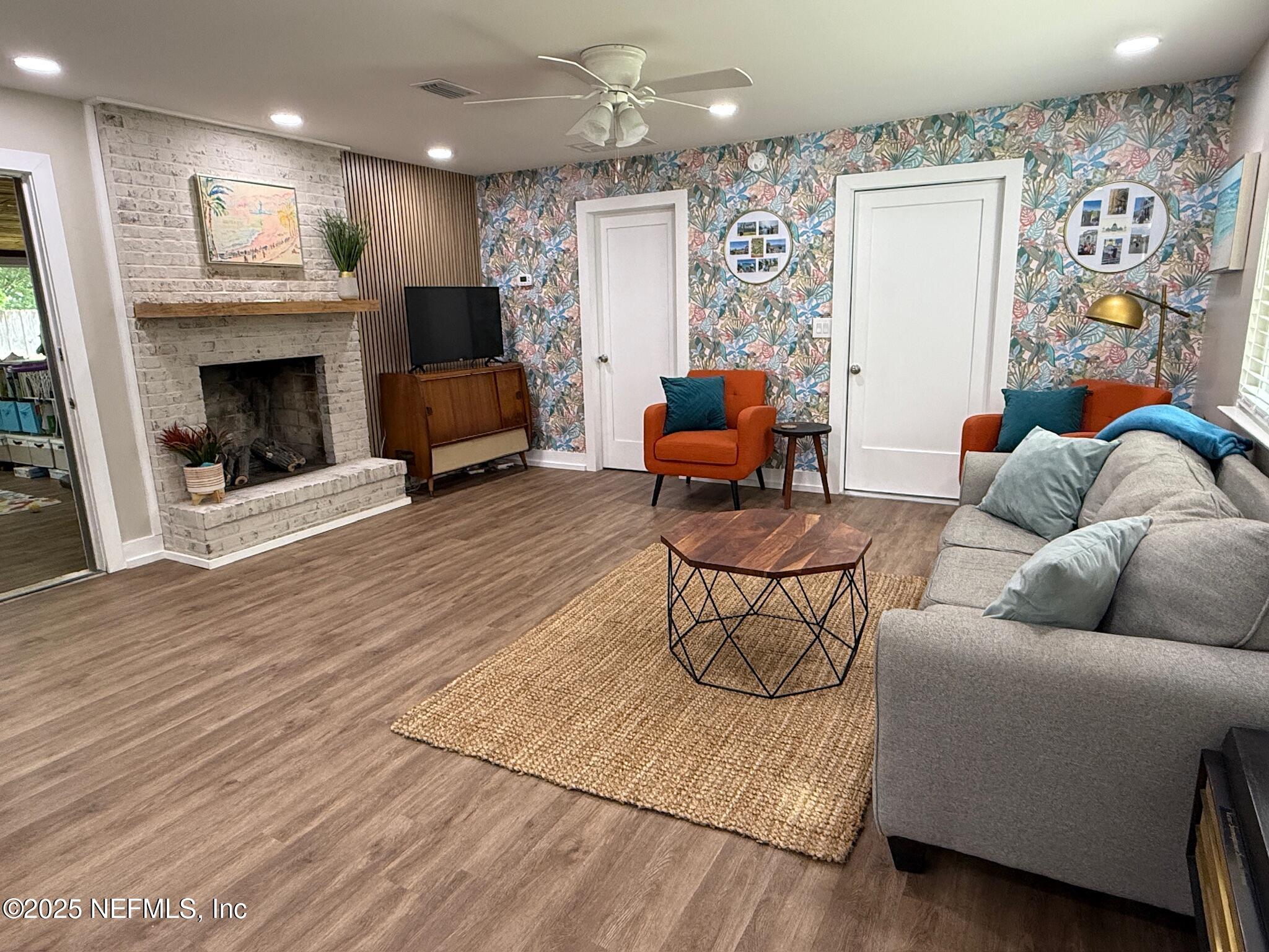 716 Oak Street Neptune Beach, FL 32266 - Photo 3 of 23 a living room with furniture and a fireplace