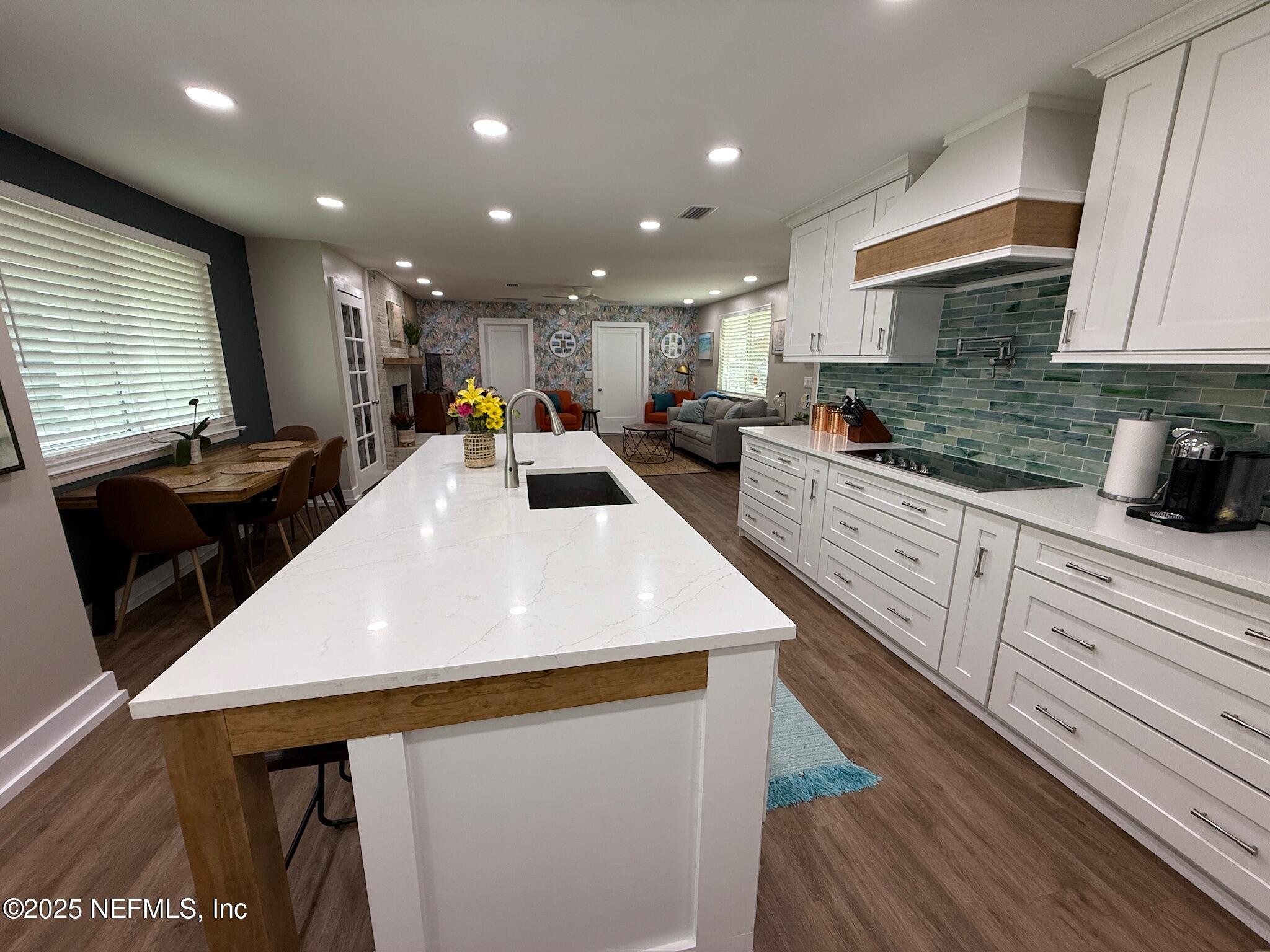 716 Oak Street Neptune Beach, FL 32266 - Photo 5 of 23 a large kitchen with sink and a large window