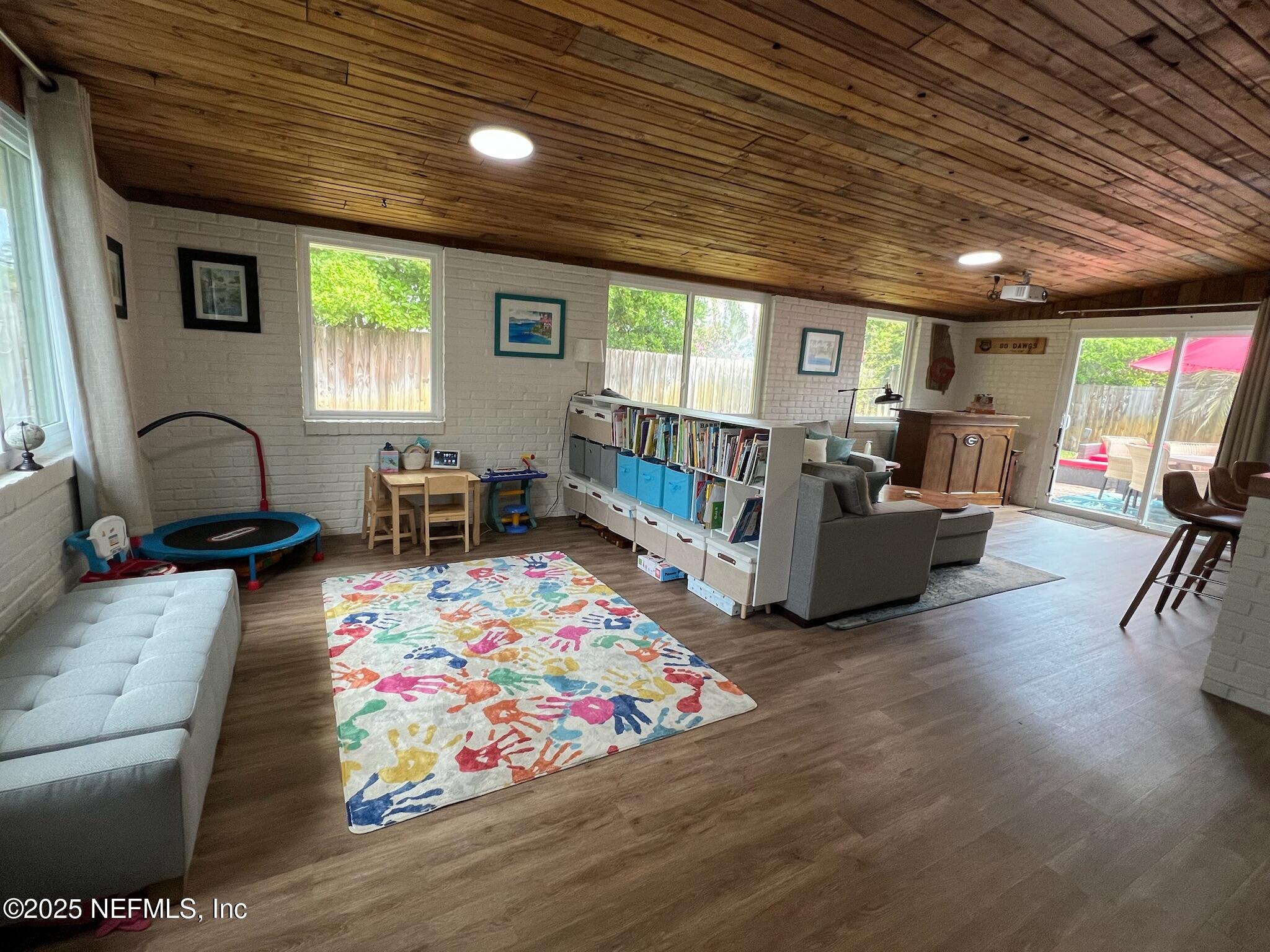 716 Oak Street Neptune Beach, FL 32266 - Photo 7 of 23 a living room with furniture and a wooden floor