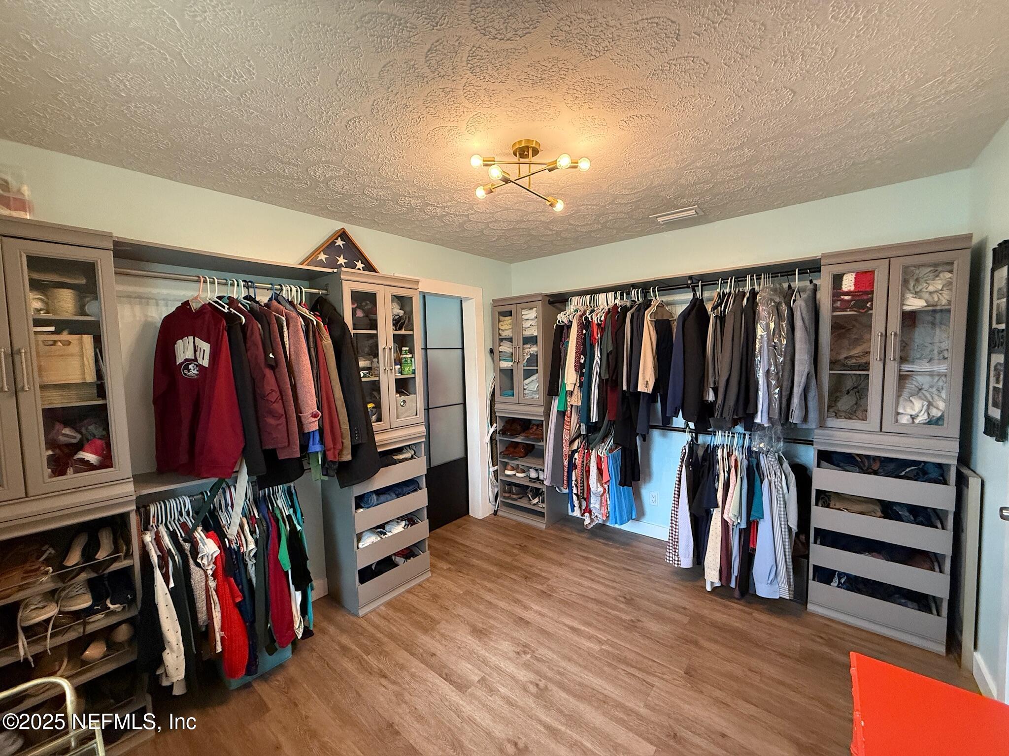 716 Oak Street Neptune Beach, FL 32266 - Photo 8 of 23 a view of walk in closet with clothes