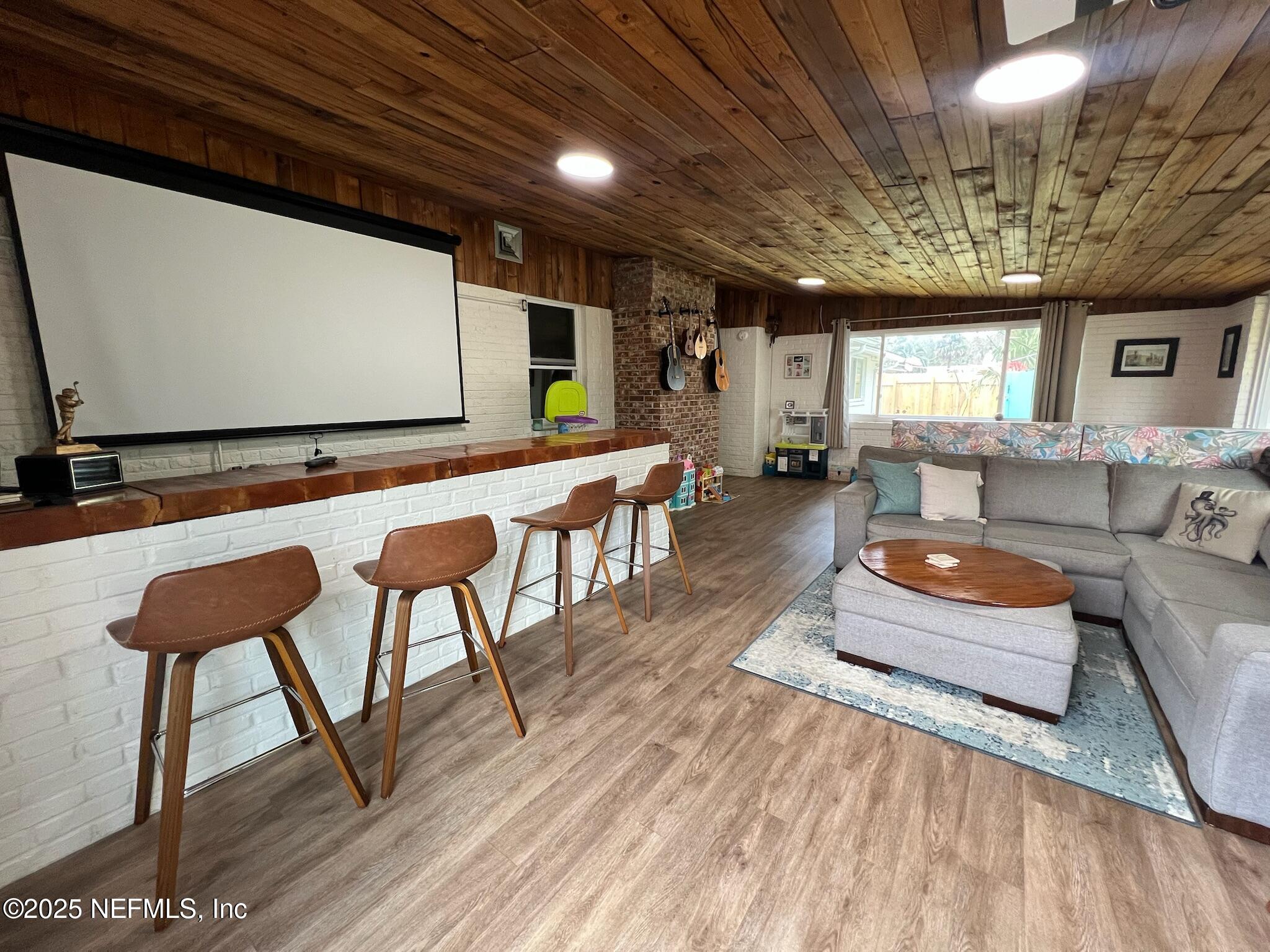 716 Oak Street Neptune Beach, FL 32266 - Photo 9 of 23 a outdoor space with lots of furniture and wooden floor