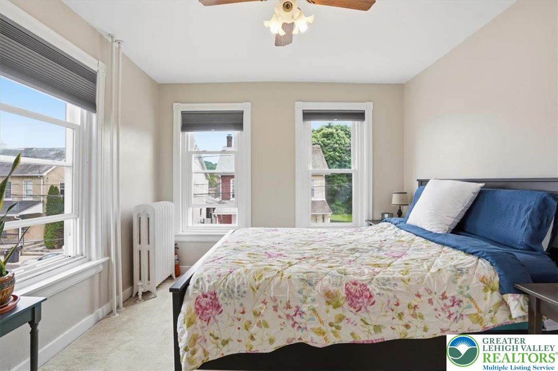 525 Ridge Street Emmaus, PA 18049 - Photo 38 of 68 This bright and inviting bedroom offers a serene retreat with ample natural light.