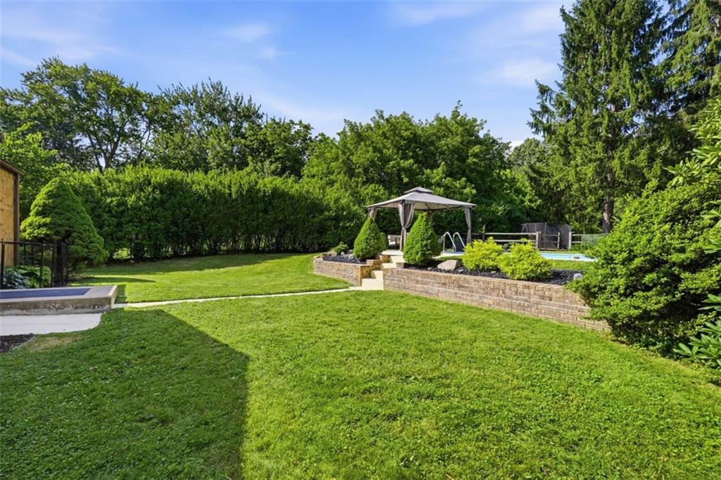 5520 Clearview Road Gibsonia, PA 15044 - Photo 30 of 48 Lush lawn space and mature privacy hedges create a serene private setting - ideal for entertaining.