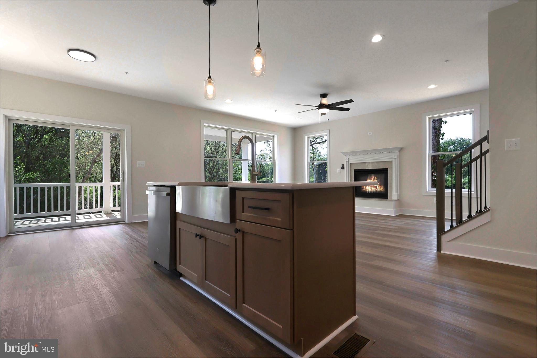 23131 Meadow Road Bushwood, MD 20618 - Photo 12 of 42 a view of a kitchen with wooden floor and a fireplace