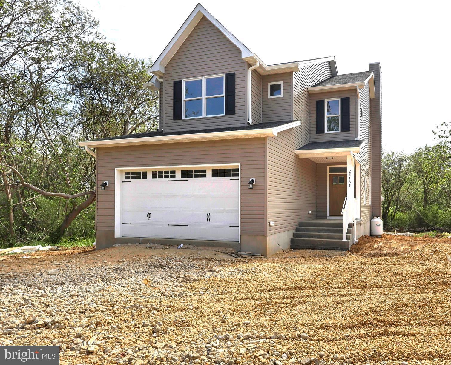 23131 Meadow Road Bushwood, MD 20618 - Photo 16 of 42 a view of a house with a yard