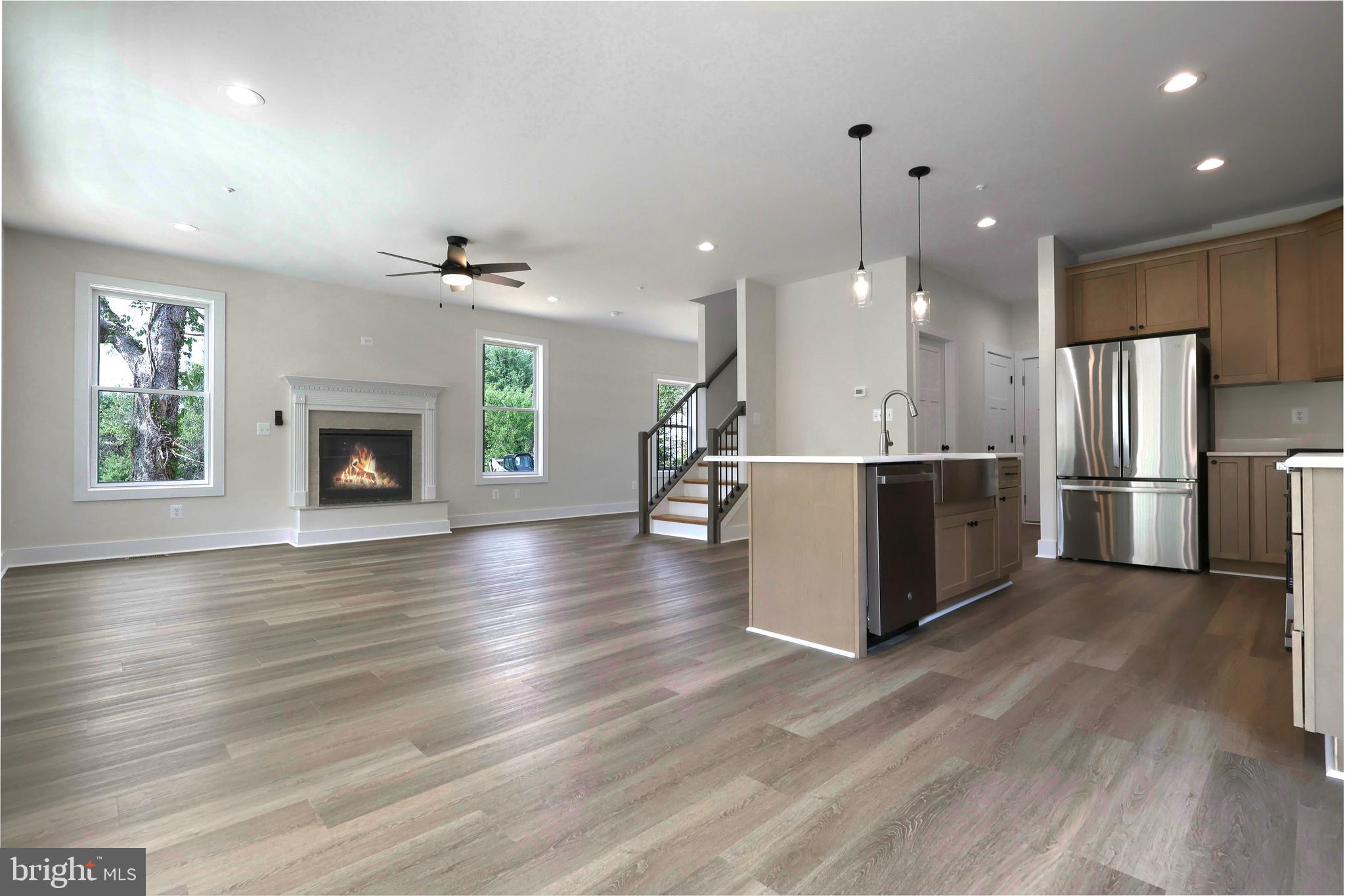 23131 Meadow Road Bushwood, MD 20618 - Photo 29 of 42 an open kitchen with a refrigerator and a stove top oven