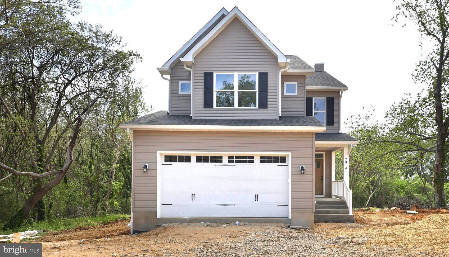 23131 Meadow Road Bushwood, MD 20618 - Photo 3 of 42 a view of a house with a garage