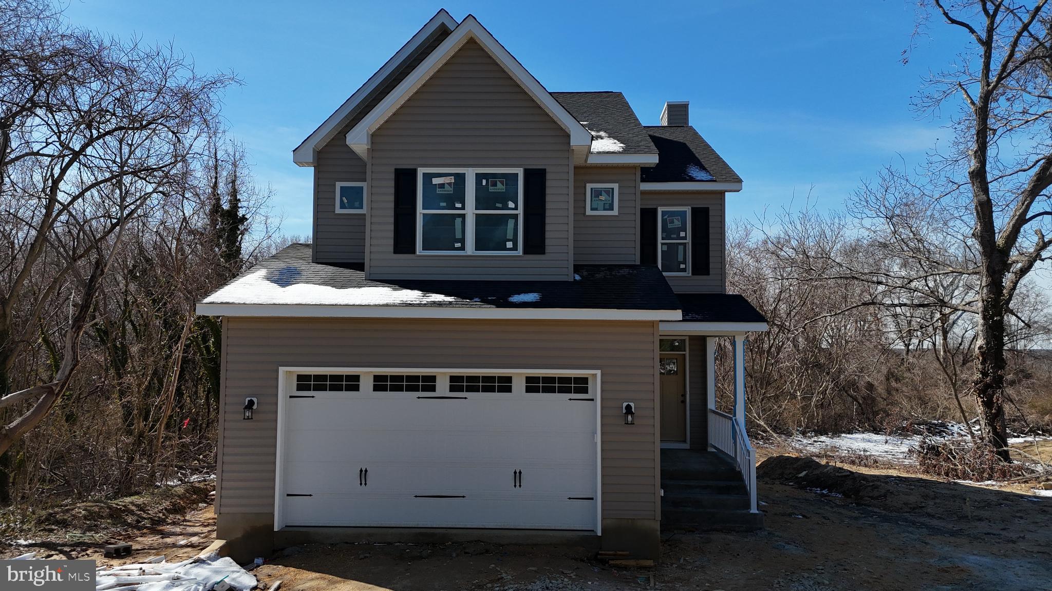 23131 Meadow Road Bushwood, MD 20618 - Photo 3 of 10 a front view of a house with a yard