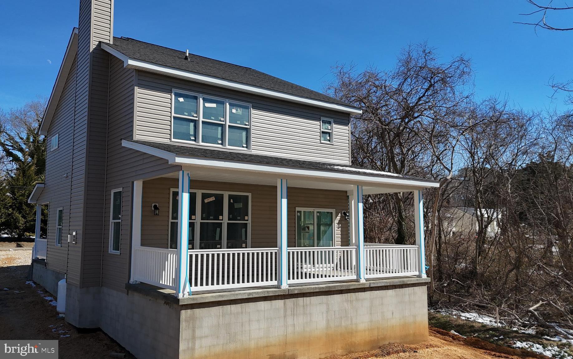 23131 Meadow Road Bushwood, MD 20618 - Photo 5 of 10 a front view of a house with a garden