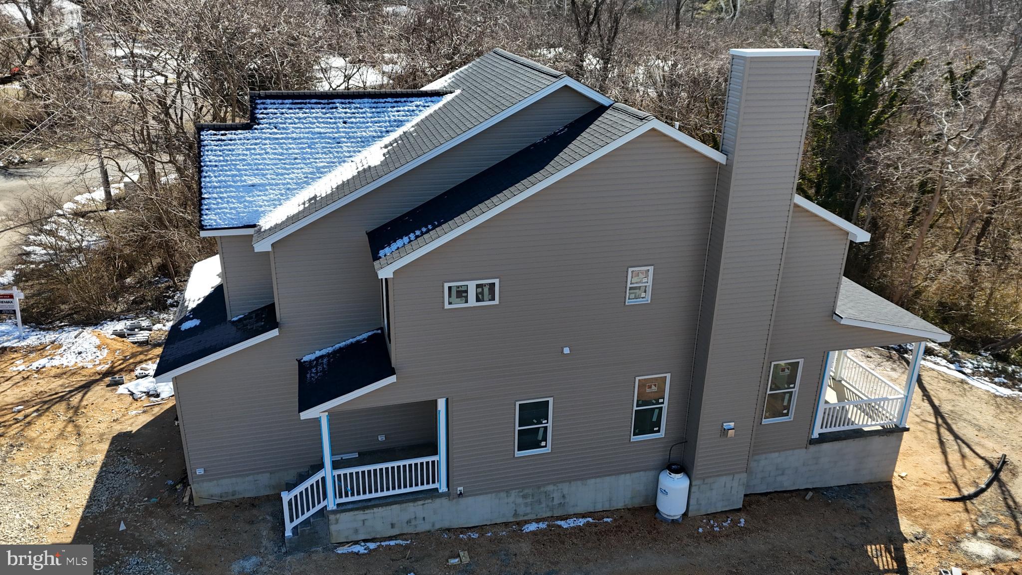 23131 Meadow Road Bushwood, MD 20618 - Photo 7 of 10 a house that has a tree in front of it
