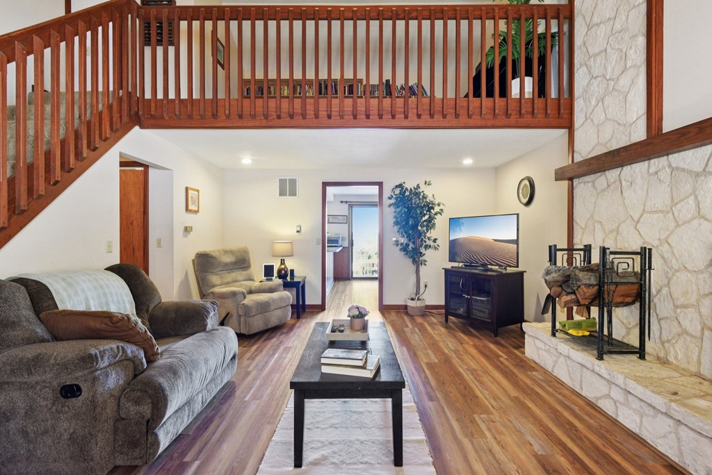 115 South Codrington Kerrville, TX 78028 - Photo 7 of 33 a living room with furniture a wooden floor and next to a window