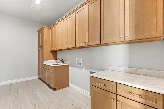 a large bathroom with a double vanity sink a large mirror and shower