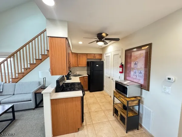 a room with furniture and a view of living room