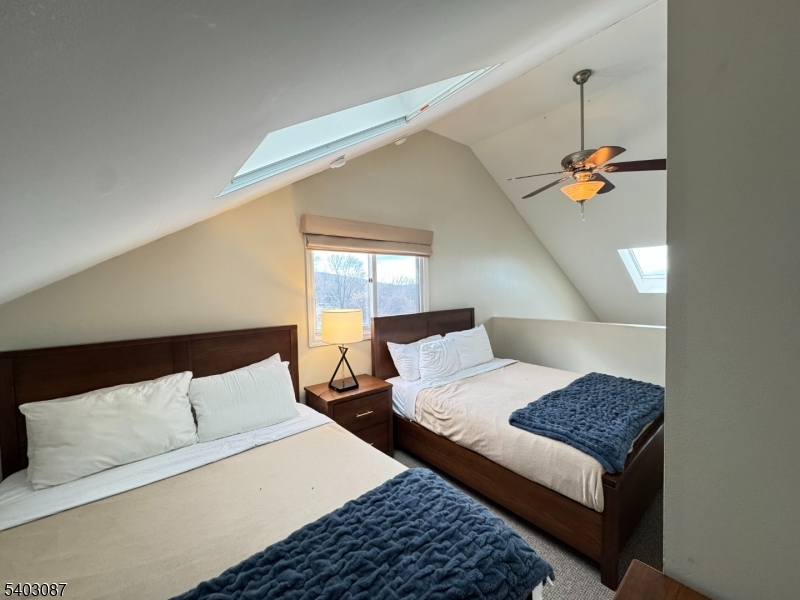 3 Telemark Drive, Unit 12 Vernon, NJ 07462 - Photo 10 of 14 a bedroom with a bed and wooden floor