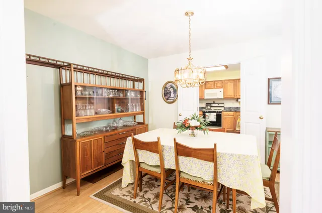 a very nice looking dining room with a table and chairs