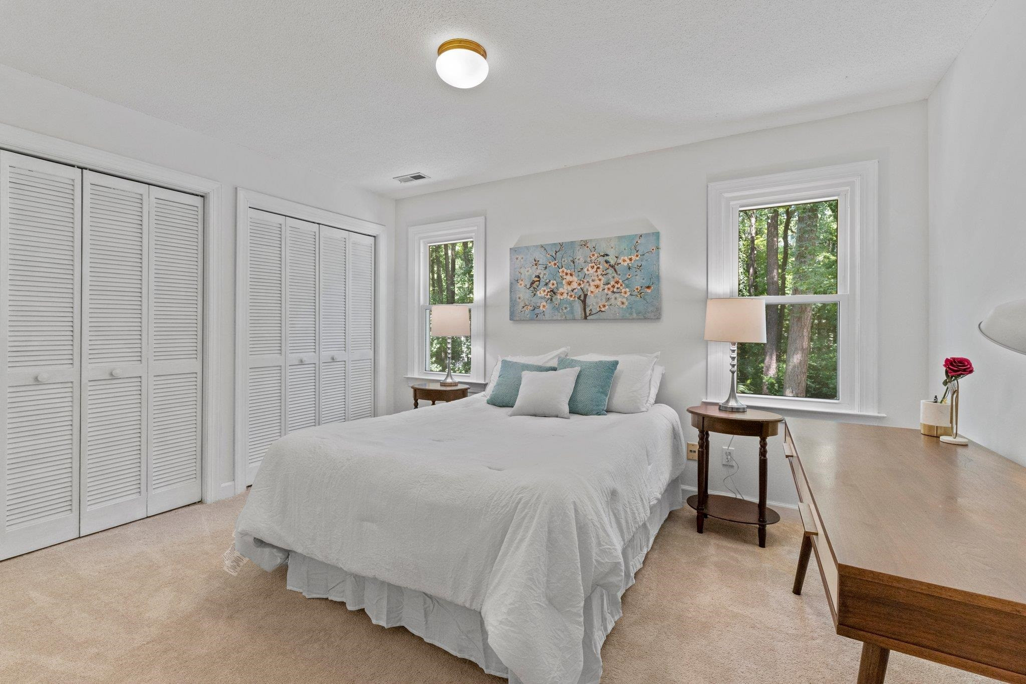 9301 Greenfield Drive Raleigh, NC 27615 - Photo 24 of 48 Bedroom 2 has two windows and two standard closets. Bedroom 2